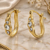 Argolla Huggie 02.164.0032 Oro Laminado, con Cristal Blanca, Pulido, Tono Dorado