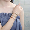 Pulsera Elegante 03.210.0120.07 Oro Laminado, Diseño de Besos y Abrazos, con Negro Zirconia Cubica, Pulido, Tono Dorado (08 MM Thickness, 7 Inches Length)
