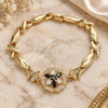 Pulsera Elegante 03.210.0130.1.08 Oro Laminado, Diseño de Flor y Besos y Abrazos, con Zirconia Cubica Negro y Blanca, Pulido, Tono Dorado (Grosor 07 MM, 8 Pulgadas de Largo)