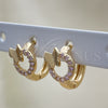 Argolla Huggie 02.284.0034.2.12 Oro Laminado, Diseño de Mariposa, con Rosado Micro Pave, Pulido, Tono Dorado