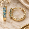 Argolla Huggie 02.210.0604.2.12 Oro Laminado, con Zirconia Cubica Topacio Azul, Pulido, Tono Dorado
