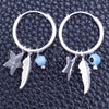 Argolla Pequeña 02.401.0033.15 Plata Rodinada, Diseño de Ojo Griego y Estrella, con Zirconia Cubica Aqua Azul, Pulido, Tono Plateado