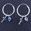 Argolla Pequeña 02.402.0009.15 Plata Rodinada, Diseño de Ojo Griego y Cruz, con Cristal Aqua Azul, Pulido, Tono Plateado
